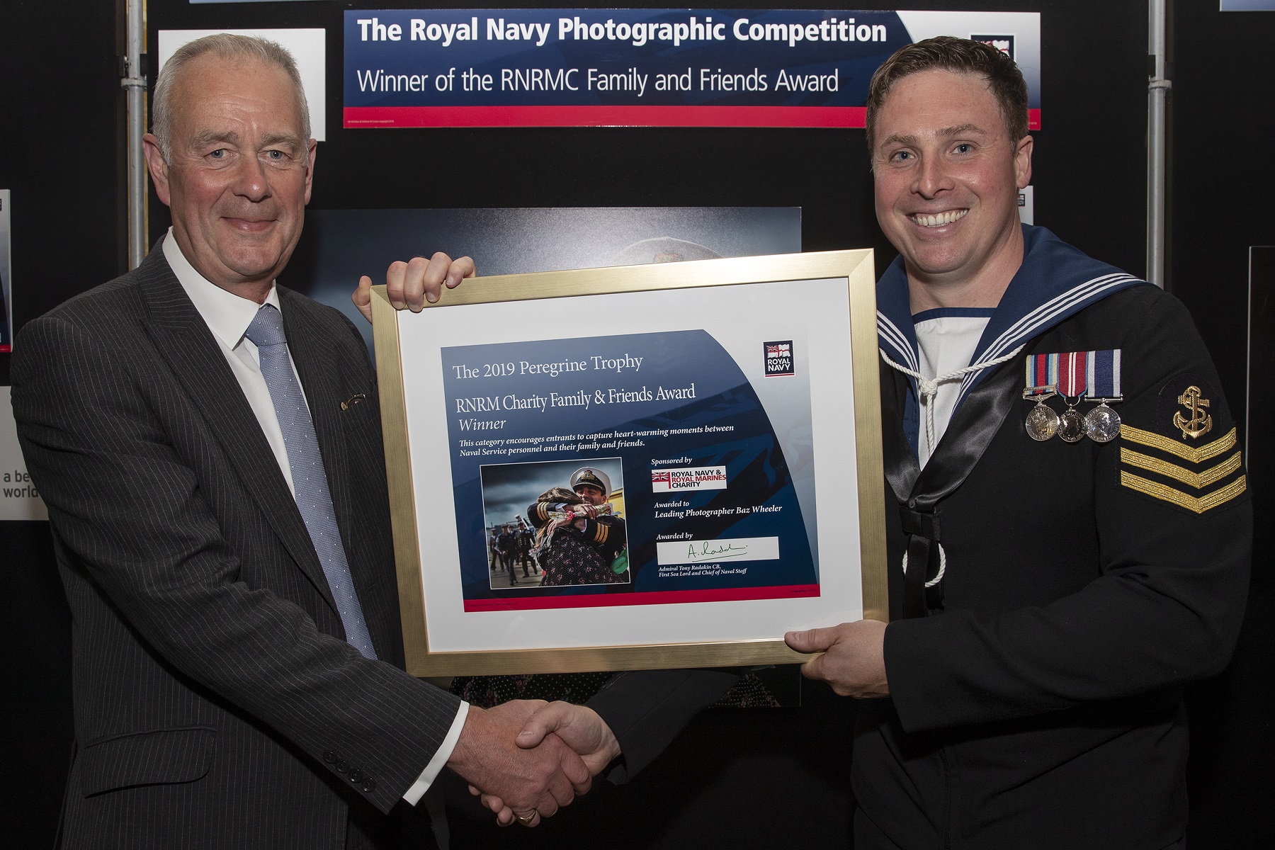 Presentation of award - CEO Adrian Bell with LPhot Barry Wheeler