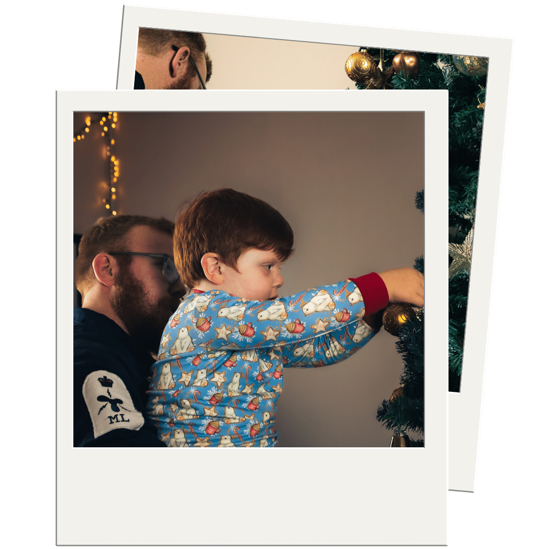 Christmas Dad and boy decorating tree