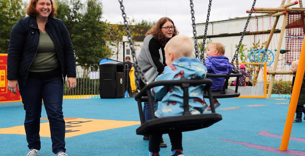 Children playing on swings at new Drumfork Children's playpark