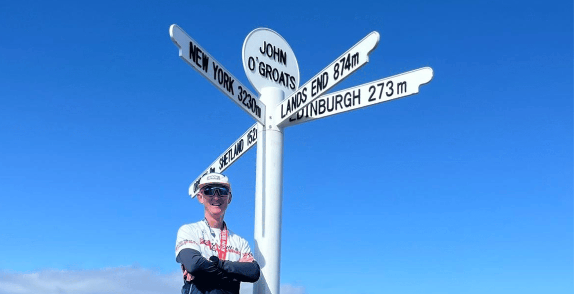 Alex at the finish line in John O'Groats